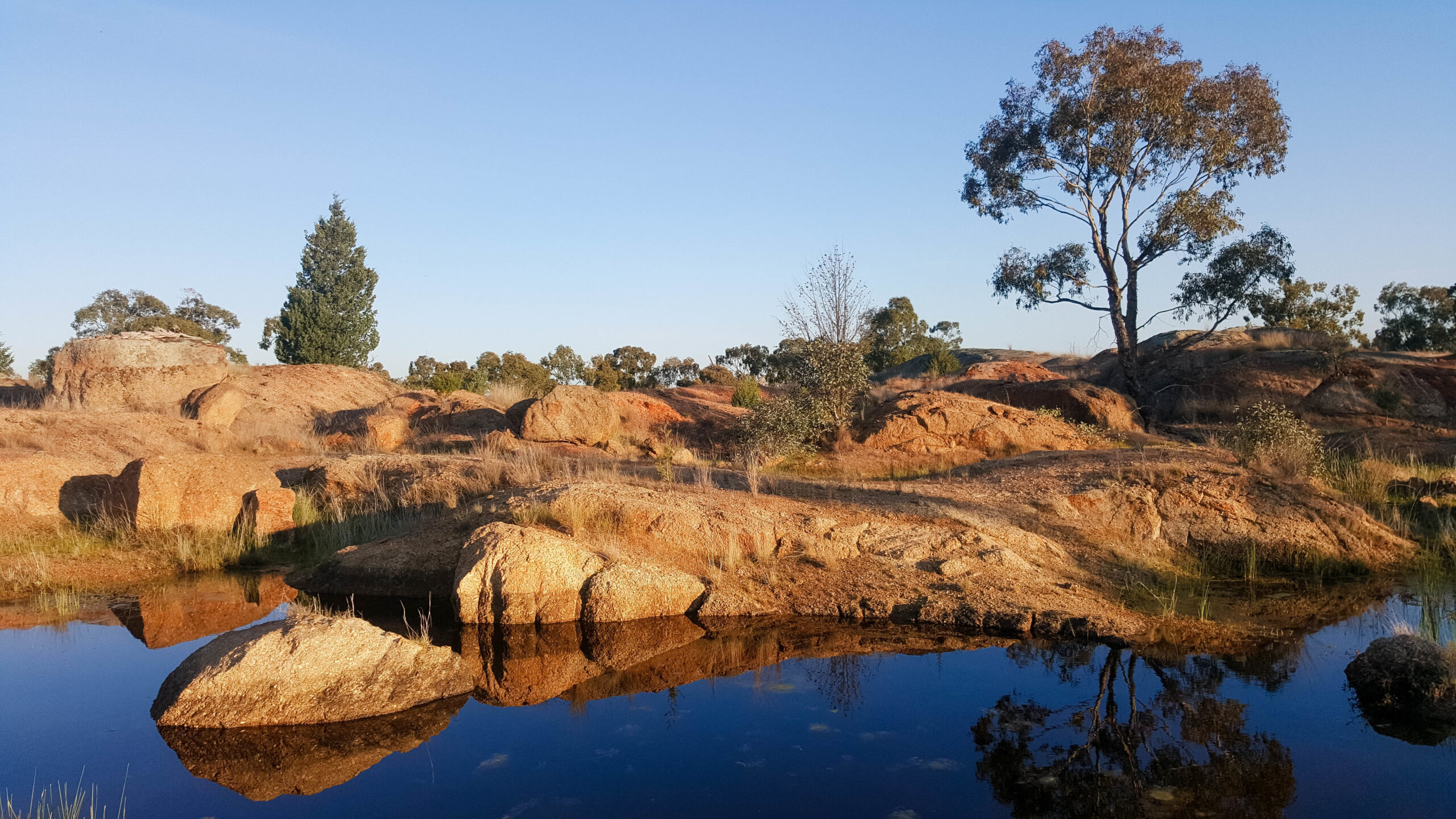 A rockpool water hole in the Terrick Terrick National Park near Mitiamo, Victoria Australia